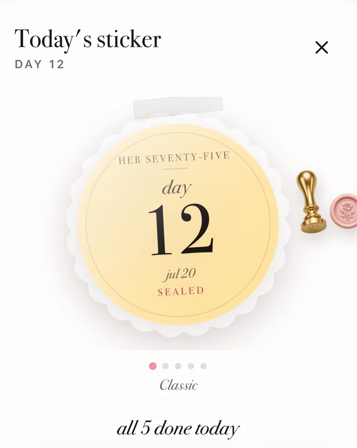 Today's sticker in 75 Her: a scalloped gold seal reading Her Seventy-Five, day 12, sealed, with the brass stamp and a rose wax seal beside it